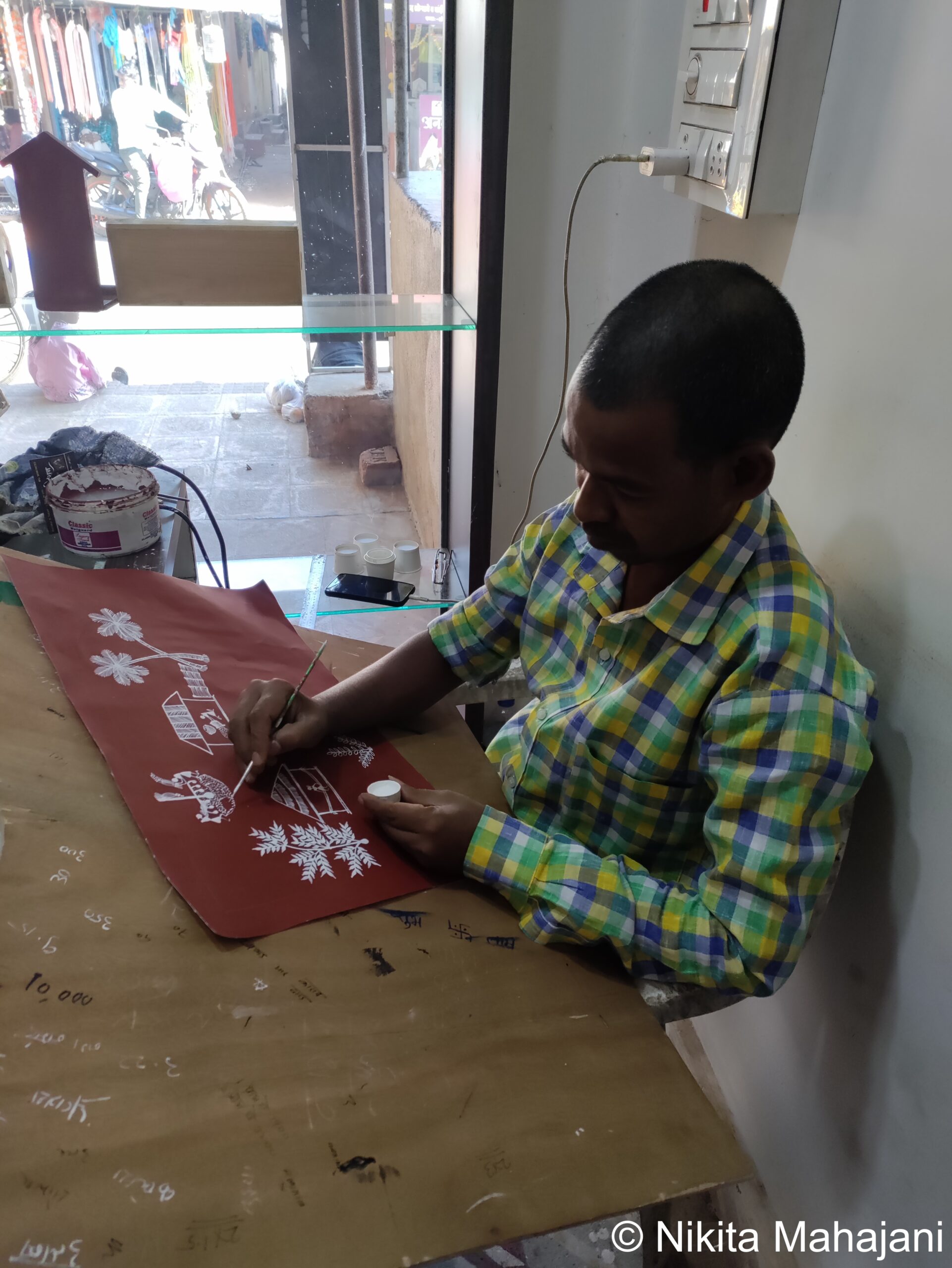 Warli artist in Jawhar